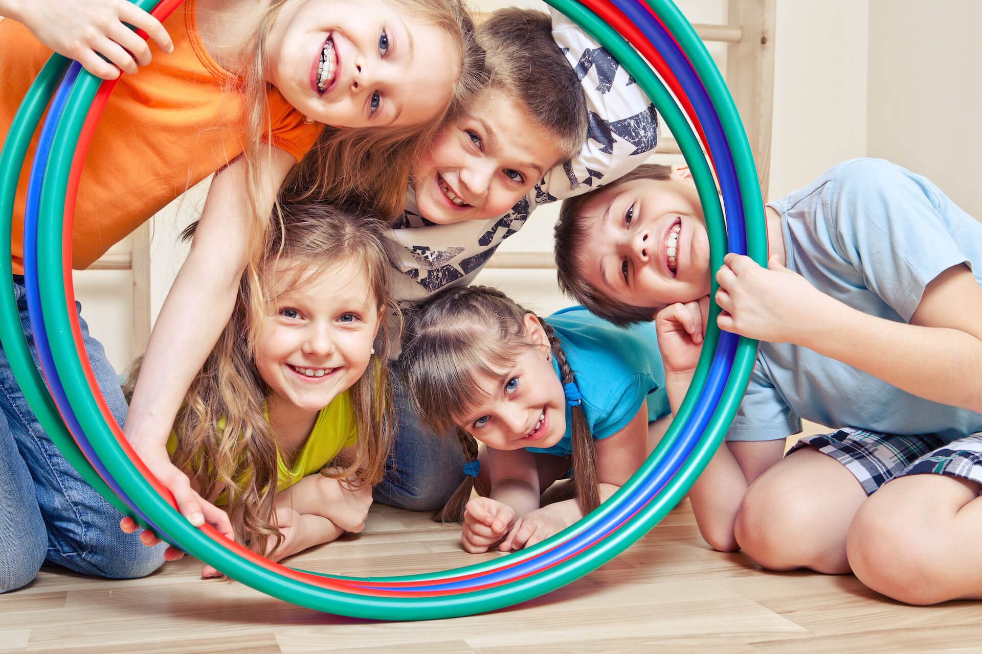 group of kids playing with hoop