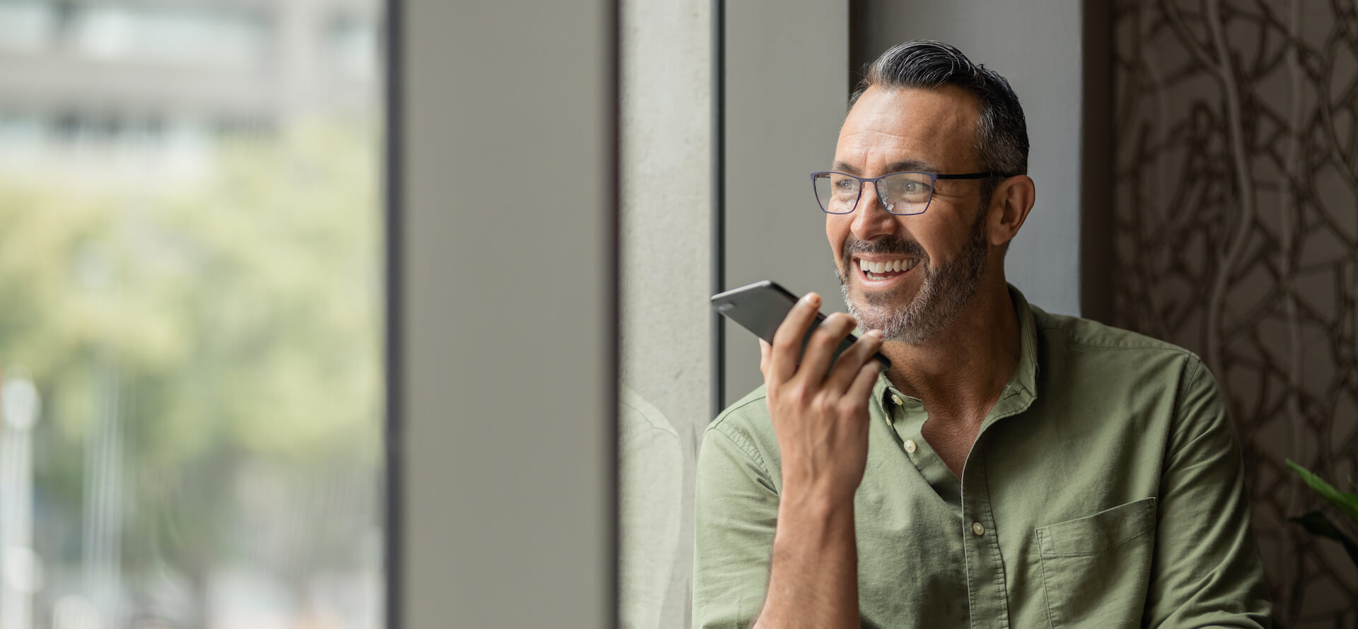 smiling man on phone
