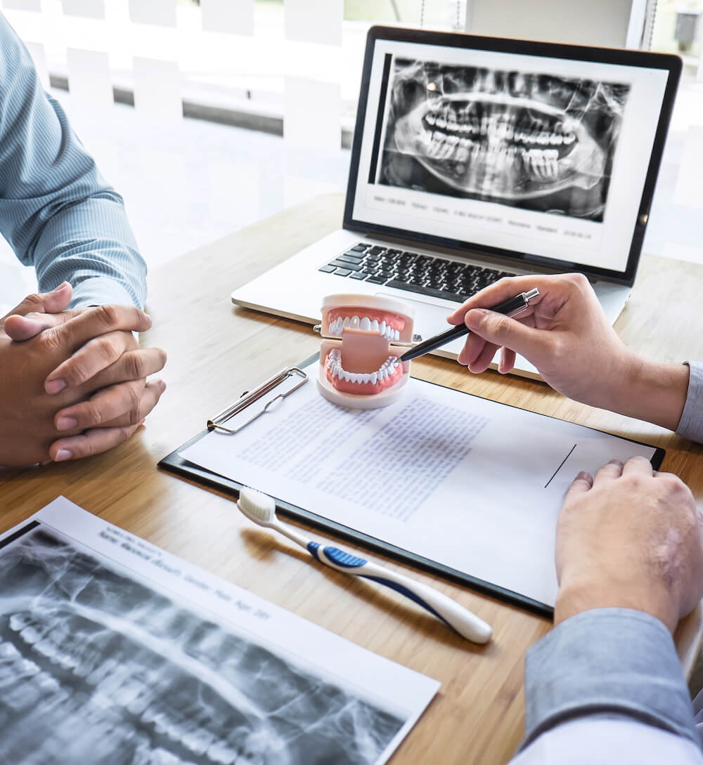 consultation with orthodontist with x-rays of jaw